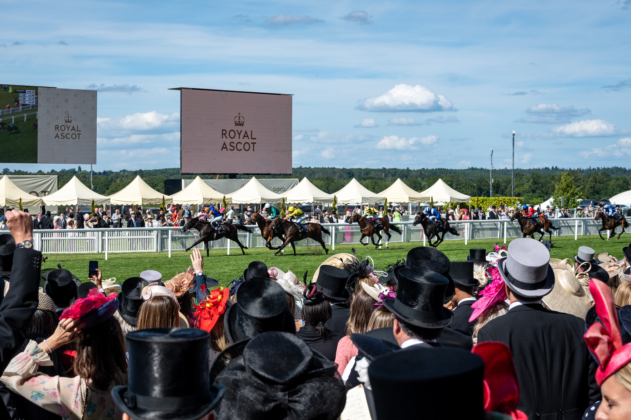 Spectators watching the horse racing at Royal Ascot in Berkshire